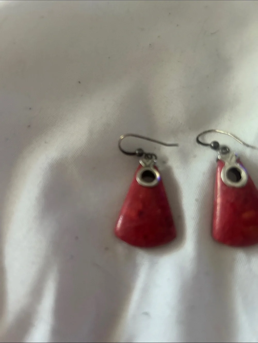 Nice silver and coral earrings. These match necklace with similar shape